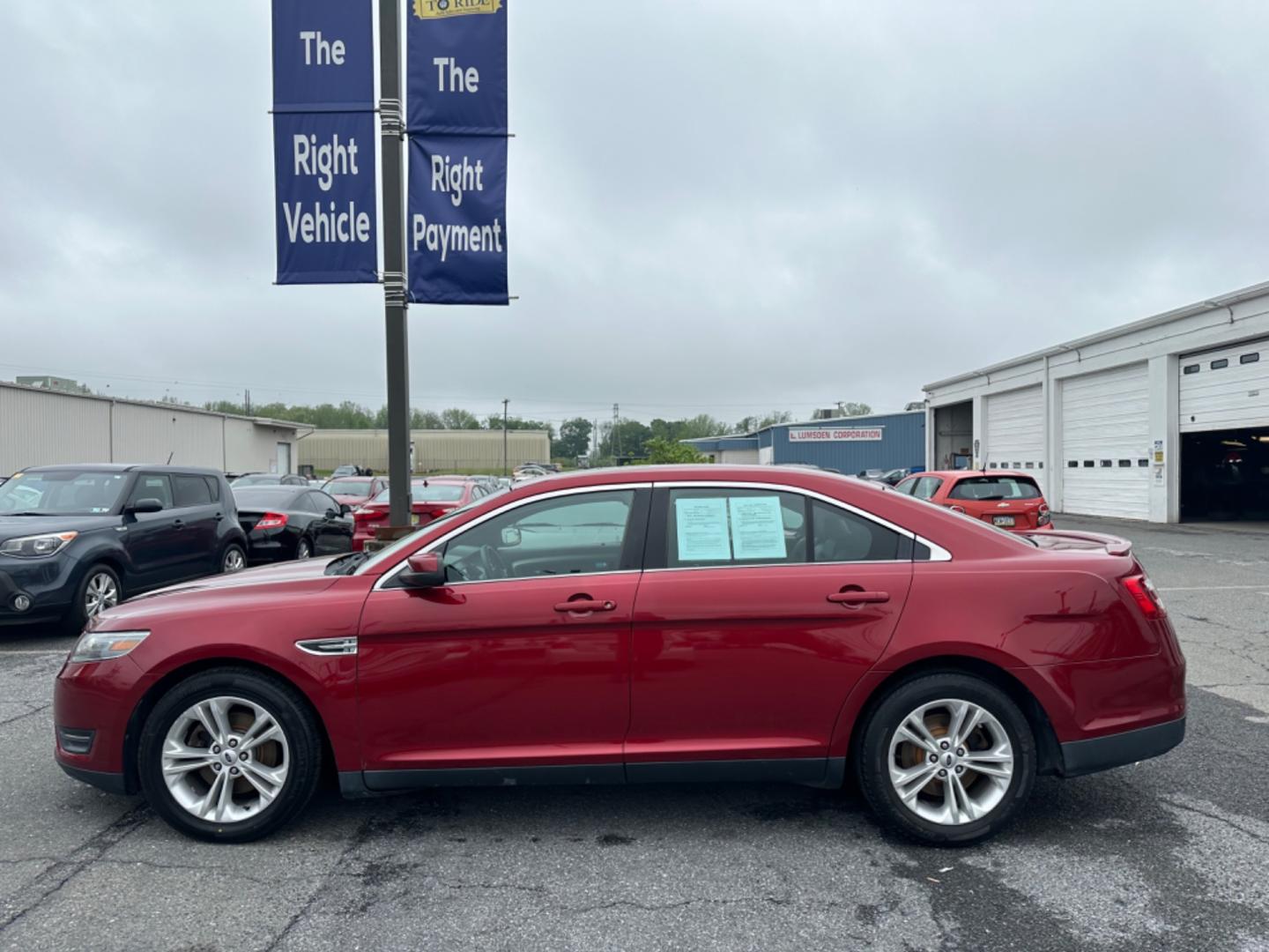 2013 RED Ford Taurus SEL FWD (1FAHP2E8XDG) with an 3.5L V6 DOHC 24V engine, 6-Speed Automatic transmission, located at 1254 Manheim Pike, Lancaster, PA, 17601, (717) 393-9133, 40.062870, -76.323273 - Photo#7